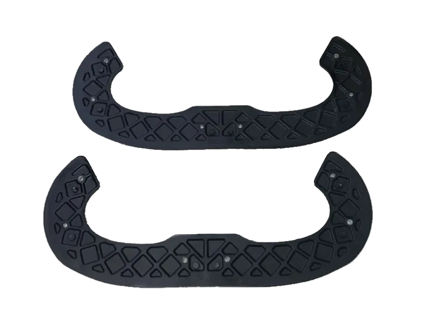 Two black rubber snowblower paddles with textured surface on a white background